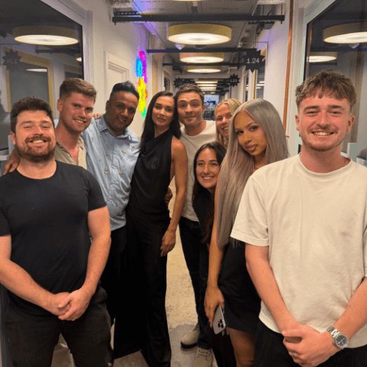 Somerce team members gathered in the office