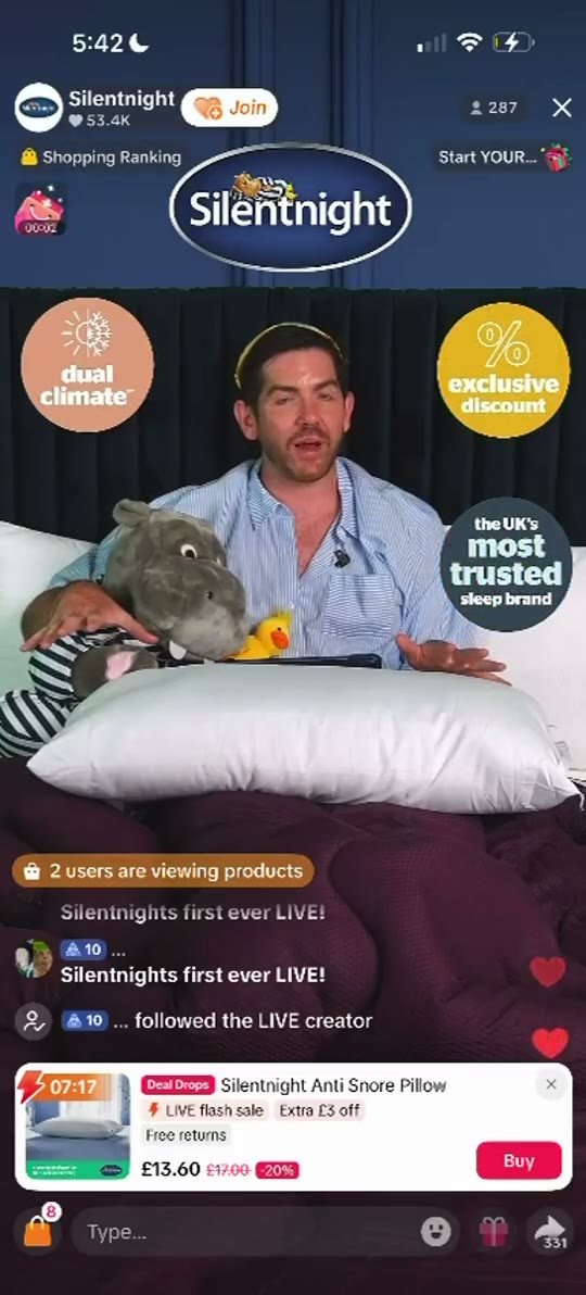 Silentnight TikTok LIVE: a host sitting on a made bed holding a grey teddy, with an anti-snore pillow pinned below at £13.60
